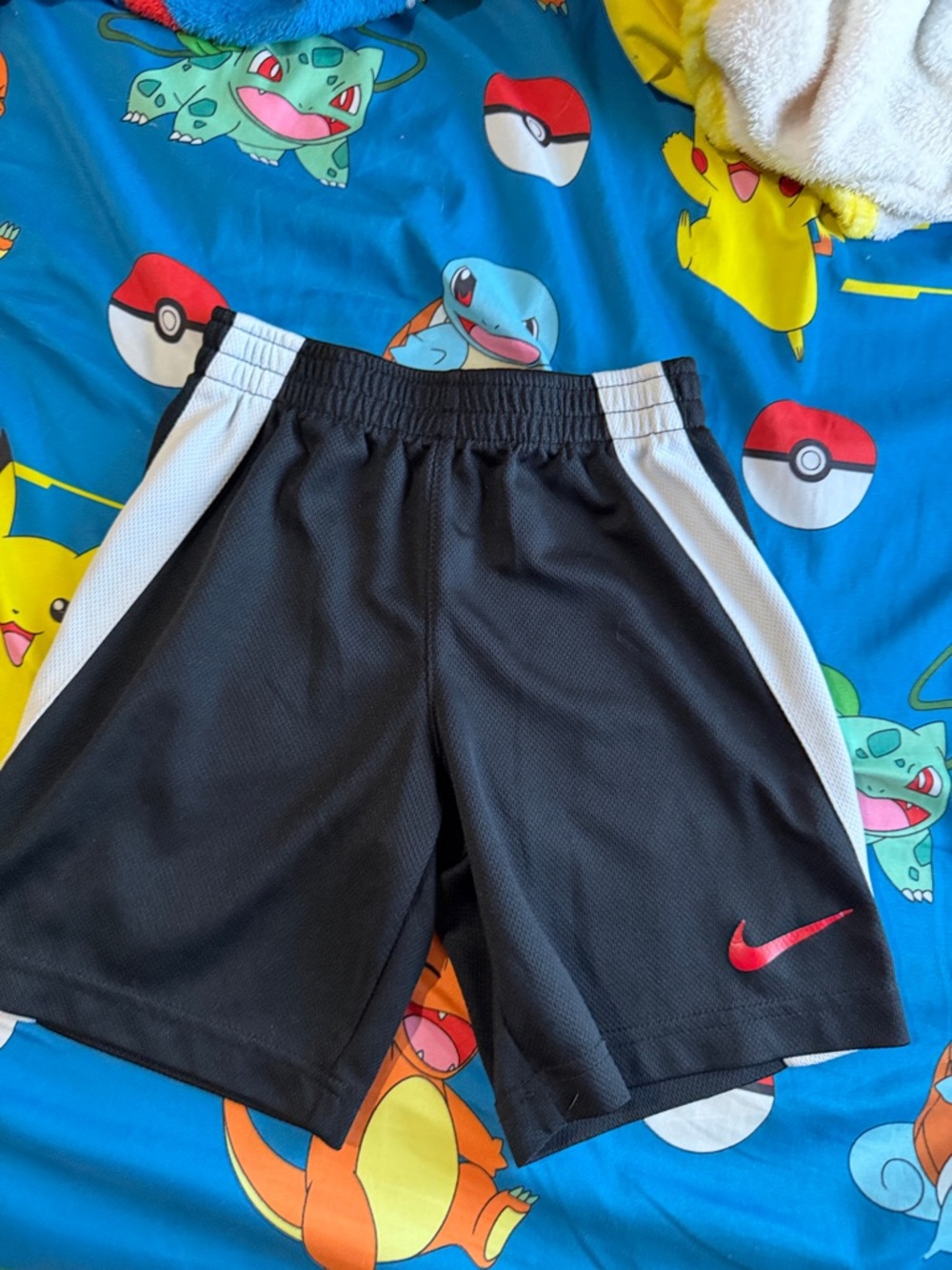 Nike Black Athletic Shorts with White Panels and Red Swoosh